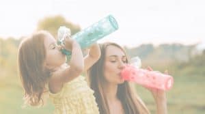 mother and daughter, drinking water, reverse osmosis, healthy drinking water, bottled water alternative